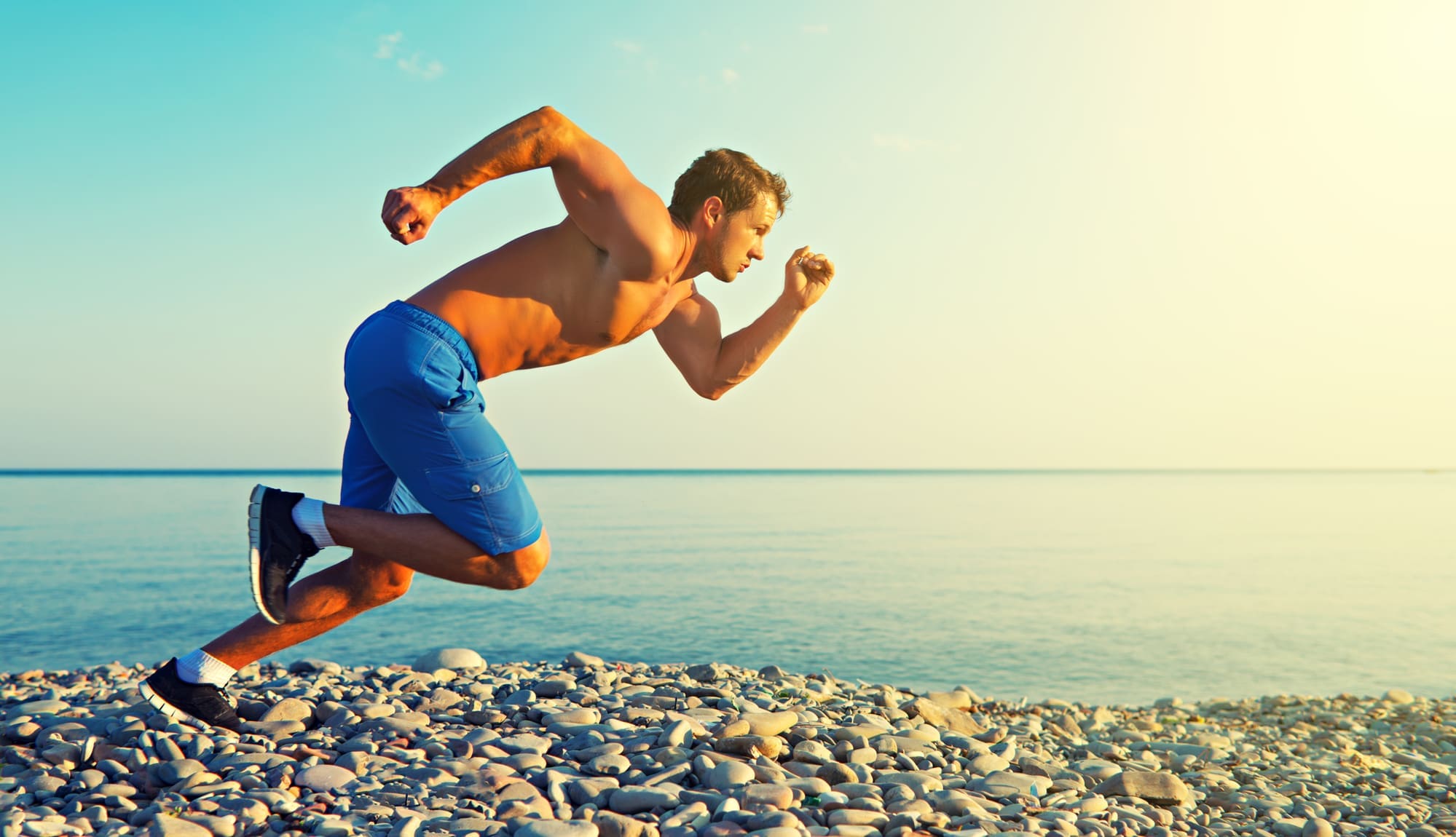 man athlete running by the sea at sunset outdoors gay chicago athlete