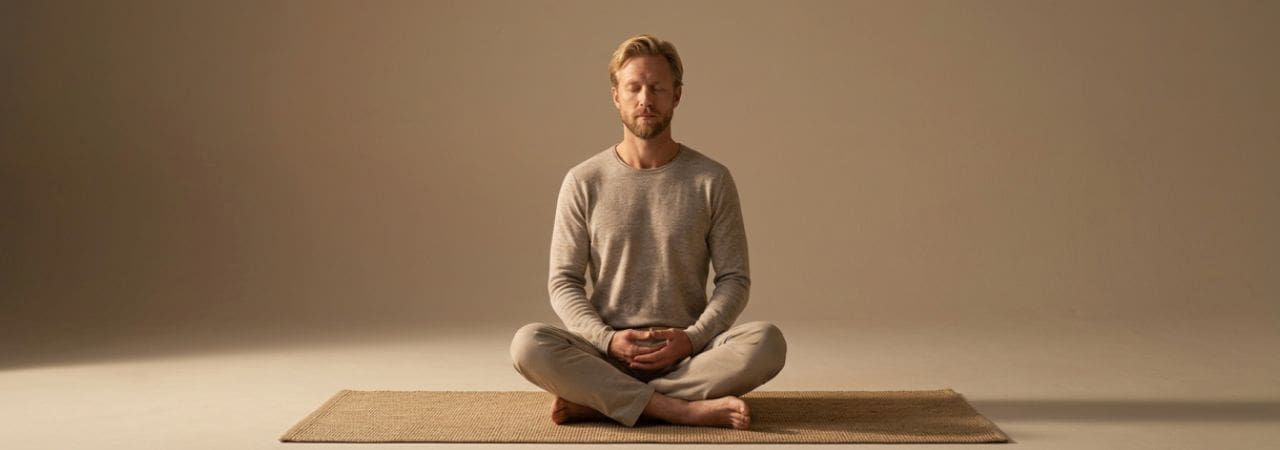 Man in seated meditation practice — mindfulness therapy at 2nd Story Counseling Chicago